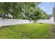 Expansive backyard with lush green grass, privacy fence, and mature trees at 462 Wallingford Circle, Myrtle Beach, SC 29588