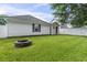 Spacious, green backyard with a fire pit and mature trees, ideal for outdoor activities at 462 Wallingford Circle, Myrtle Beach, SC 29588