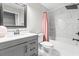 Modern bathroom featuring a shower-tub combo with marble tile surround and gray vanity at 462 Wallingford Circle, Myrtle Beach, SC 29588