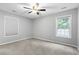 Bright bedroom featuring plush carpet, neutral walls and natural light from the dual windows at 462 Wallingford Circle, Myrtle Beach, SC 29588