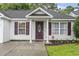 Inviting front of home featuring a decorative front door, columns, and tidy landscaping at 462 Wallingford Circle, Myrtle Beach, SC 29588