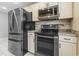 Modern kitchen with stainless steel appliances and ample cabinet space at 462 Wallingford Circle, Myrtle Beach, SC 29588