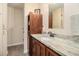 Bathroom boasts a vanity with beautiful granite countertop and a wooden cabinet at 475 Willard Rd., Conway, SC 29526