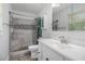 Updated bathroom featuring tile shower with glass door, modern vanity, and neutral color scheme at 475 Willard Rd., Conway, SC 29526