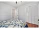 Bright bedroom features a ceiling fan, hardwood floors, and a spacious closet at 475 Willard Rd., Conway, SC 29526