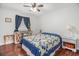 Comfortable bedroom with a ceiling fan, hardwood floors, and a window letting in natural light at 475 Willard Rd., Conway, SC 29526