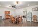 Bright dining room featuring a large wooden table, decorative cabinets, and elegant lighting fixtures at 475 Willard Rd., Conway, SC 29526