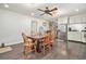 Inviting dining room featuring a dark wood floor and table with a fan above at 475 Willard Rd., Conway, SC 29526