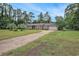 Charming brick home with a long driveway and mature trees, offering a serene and private setting at 475 Willard Rd., Conway, SC 29526