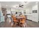 Open-concept kitchen with white cabinets, stainless steel appliances, and a dining area, perfect for modern living at 475 Willard Rd., Conway, SC 29526