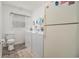 Functional laundry room with a washer, dryer, and a convenient toilet at 475 Willard Rd., Conway, SC 29526