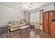 Cozy living room with a comfortable couch, rocking chair and dark wood floor at 475 Willard Rd., Conway, SC 29526