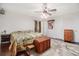 Spacious main bedroom with a dark wood floor, large bed, and ceiling fan at 475 Willard Rd., Conway, SC 29526