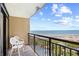 Relaxing balcony space with chairs and a view of the ocean, beach and swimming pool at 4800 S Ocean Blvd. # 514, North Myrtle Beach, SC 29582
