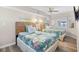 Bedroom showcasing two beds with tropical themed bedspreads and ceiling fan at 4800 S Ocean Blvd. # 514, North Myrtle Beach, SC 29582