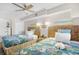 Bedroom featuring two beds with tropical themed bedspreads at 4800 S Ocean Blvd. # 514, North Myrtle Beach, SC 29582