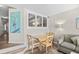 Dining area with table and chairs and view to a living area at 4800 S Ocean Blvd. # 514, North Myrtle Beach, SC 29582