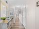 Hallway with wood floors and view to other room with a bed at 4800 S Ocean Blvd. # 514, North Myrtle Beach, SC 29582