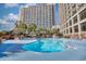 Large outdoor pool area with lounge chairs and beautiful views of the resort and ocean at 4800 S Ocean Blvd. # 514, North Myrtle Beach, SC 29582
