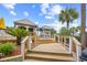 Pool bar on a wooden deck with palm trees in the background at 4800 S Ocean Blvd. # 514, North Myrtle Beach, SC 29582