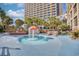 Gathering-friendly outdoor pool area with a whimsical mushroom fountain and comfortable seating at 4800 S Ocean Blvd. # 514, North Myrtle Beach, SC 29582