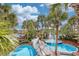 Stunning aerial view of resort pools with a charming bridge and lush tropical landscaping at 4800 S Ocean Blvd. # 514, North Myrtle Beach, SC 29582