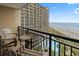 Balcony view overlooking the ocean and the building's pool at 4800 S Ocean Blvd. # 920, North Myrtle Beach, SC 29582