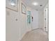Hallway with unique stained glass window accents and a wood grain tile floor leading to a white door at 4800 S Ocean Blvd. # 920, North Myrtle Beach, SC 29582
