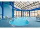 Spacious indoor pool with a glass ceiling, offering natural light and a resort atmosphere at 4800 S Ocean Blvd. # 920, North Myrtle Beach, SC 29582