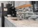 Close up of kitchen counter with coffee maker and backsplash at 4800 S Ocean Blvd. # 920, North Myrtle Beach, SC 29582