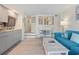 Comfortable living area with a modern kitchen and stairs leading to another level at 4800 S Ocean Blvd. # 920, North Myrtle Beach, SC 29582