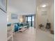 Bright living room with a large sofa and balcony access with ocean views at 4800 S Ocean Blvd. # 920, North Myrtle Beach, SC 29582