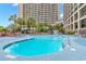 Outdoor pool area with swimming pool and chairs at 4800 S Ocean Blvd. # 920, North Myrtle Beach, SC 29582