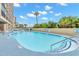 Sparkling outdoor pool surrounded by lush greenery, perfect for a refreshing swim at 4800 S Ocean Blvd. # 920, North Myrtle Beach, SC 29582