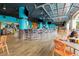 Vibrant restaurant with surf decor, bar seating, and casual dining, creating a lively atmosphere at 4800 S Ocean Blvd. # 920, North Myrtle Beach, SC 29582