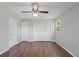 Spacious bedroom featuring laminate wood floors, large closet, and ample natural light from the window at 482 Greenview Dr. # 5B, Johnsonville, SC 29555