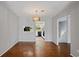View of dining room with chandelier and view of kitchen area at 482 Greenview Dr. # 5B, Johnsonville, SC 29555