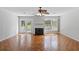 Bright living room featuring a fireplace, wood floors and access to outdoor patio at 482 Greenview Dr. # 5B, Johnsonville, SC 29555