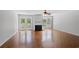 Bright living room featuring a fireplace, wood floors and access to outdoor patio at 482 Greenview Dr. # 5B, Johnsonville, SC 29555