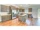 Modern kitchen with stainless steel appliances, a center island with seating, and rich dark wood cabinets at 4867 Wolf Trail, Conway, SC 29527