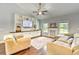 Bright living room features built-in shelving, a cozy fireplace, and large windows that provide natural light at 4867 Wolf Trail, Conway, SC 29527