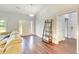 Bright living room with a sofa, front door, and doorway to the hallway at 4867 Wolf Trail, Conway, SC 29527
