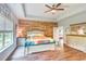 Serene main bedroom features a wood accent wall, and ample natural light, creating a relaxing retreat at 4867 Wolf Trail, Conway, SC 29527