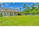 Beautiful green front yard featuring a well manicured lawn with garden bed at 4867 Wolf Trail, Conway, SC 29527