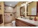 Elegant bathroom featuring a double vanity, walk-in shower, and neutral color scheme at 4894 Luster Leaf Circle # 403, Myrtle Beach, SC 29577