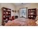 Spacious bedroom offering a comfortable bed, two bookshelves, and well-lit window at 4894 Luster Leaf Circle # 403, Myrtle Beach, SC 29577
