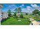 Beautiful aerial view of a community featuring green spaces, trees, and multiple buildings at 4894 Luster Leaf Circle # 403, Myrtle Beach, SC 29577