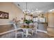 Charming dining area with a chandelier and views into the kitchen, perfect for entertaining at 4894 Luster Leaf Circle # 403, Myrtle Beach, SC 29577