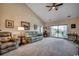 Spacious living room with a comfortable sofa, natural light, and easy access to the balcony at 4894 Luster Leaf Circle # 403, Myrtle Beach, SC 29577