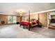 Spacious bedroom with a four-poster bed, large window, and ample natural light at 4920 Meadow St., Loris, SC 29569